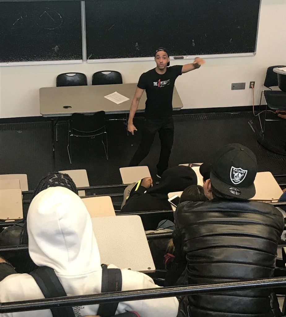 Michael Ducille teaching a classroom of students